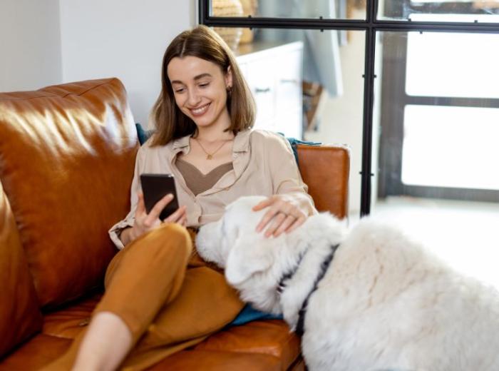 person_with_dog_on_phone.jpg
